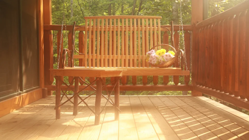 Cozy front porch with a swing and chairs, inviting conversation — MoxieMart contact page