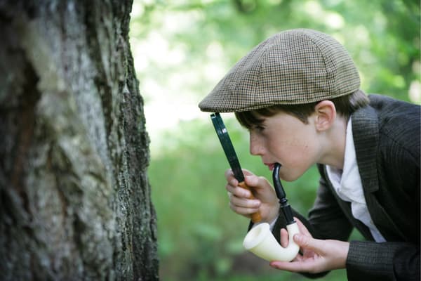Little boy dressed as Sherlock Holmes