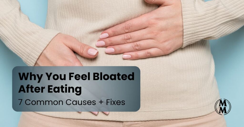 woman holding stomach bloated after eating